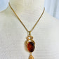 Vintage 1970s Unsigned Goldette Carved Venus Cupid Glass Pendant Necklace
